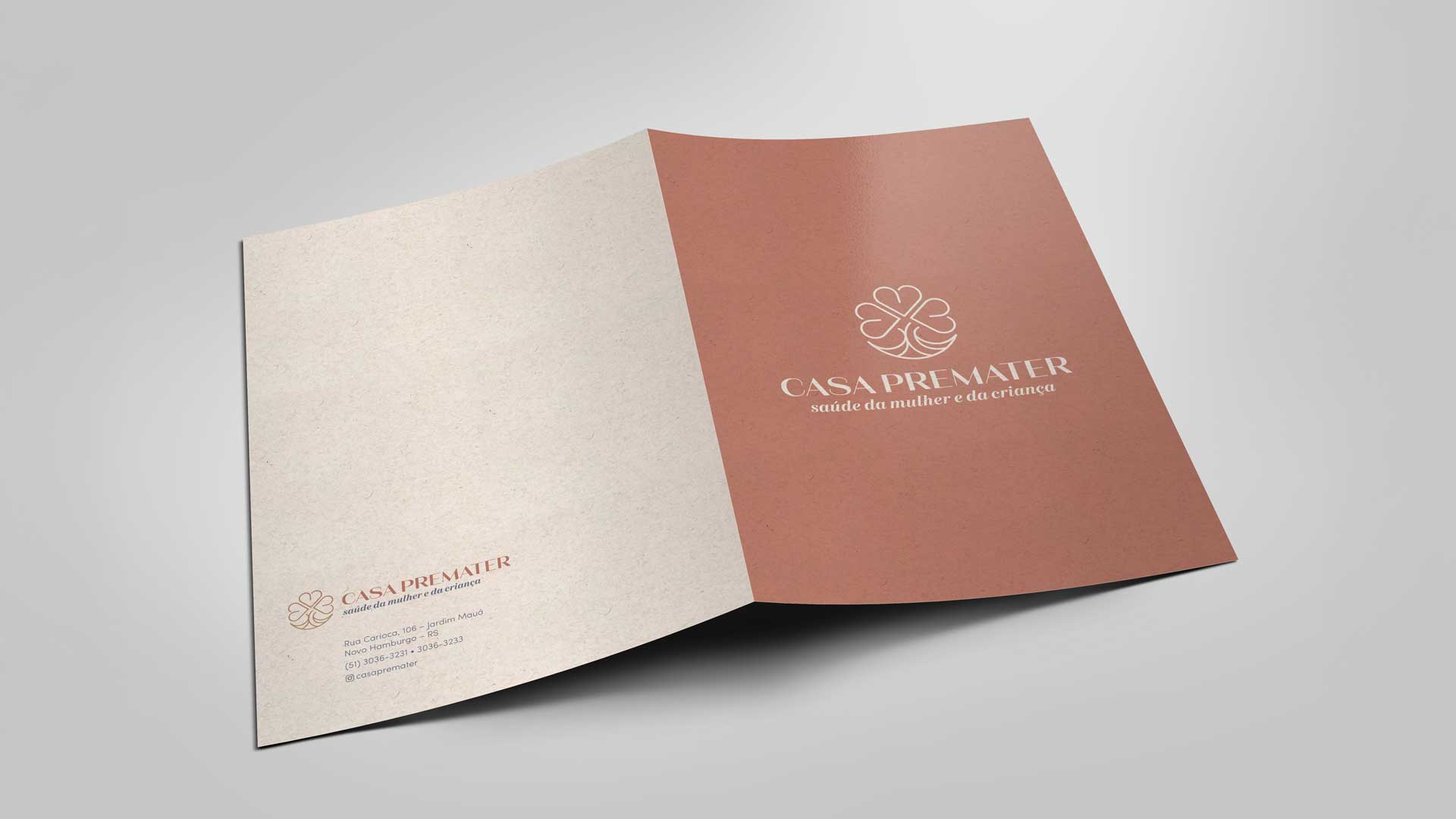 Criação de arte para materiais de papelaria da clínica Casa Premater.